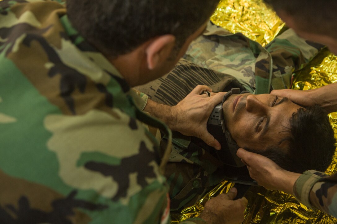 Peshmerga soldiers participate in a first aid medical exercise at the Bnaslawa Training Center near Erbil, Iraq, on May 22, 2019.  The exercise concluded a two-week intermediate combat life saver course for 21 participating Peshmerga soldiers under the direction of Italian Carabinieri instructors.  At the invitation of the Government of Iraq, members of the Global Coalition provide training and advice to local forces in support of the enduring mission to defeat Daesh. (U.S. Army photo by Spc. Kahlil Dash)