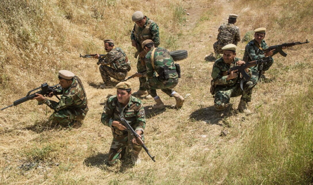 Peshmerga soldiers prepare to conduct a squad attack exercise at Bnaslawa Training Center near Erbil, Iraq, May 22, 2019.  The exercise was led by Peshmerga trainers under the guidance of Italian Army instructors.  The soldiers are among more than 500 Peshmerga soldiers participating in 10 weeks of training with the support of Coalition Forces.  At the invitation of the Government of Iraq, members of the Global Coalition provide training and advice to local forces in support of the enduring mission to defeat Daesh. (U.S. Army photo by Spc. Kahlil Dash)