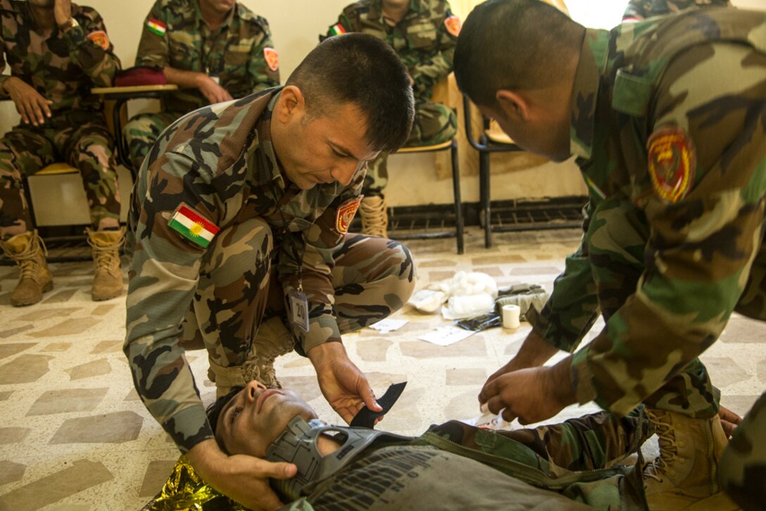 Peshmerga soldiers participate in a first aid medical exercise at the Bnaslawa Training Center near Erbil, Iraq, on May 22, 2019.  The exercise concluded a two-week intermediate combat life saver course for 21 Peshmerga soldiers, under the direction of Italian Carabinieri instructors.  At the invitation of the Government of Iraq, members of the Global Coalition provide training and advice to local forces in support of the enduring mission to defeat Daesh. (U.S. Army photo by Spc. Kahlil Dash)
