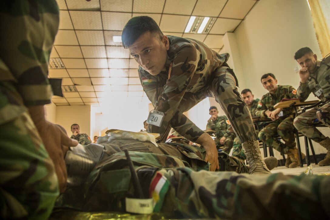 Peshmerga soldiers participate in a first aid medical exercise at the Bnaslawa Training Center near Erbil, Iraq, on May 22, 2019.  The exercise concluded a two-week intermediate combat life saver course for 21 Peshmerga soldiers under the direction of Italian Carabinieri instructors.  At the invitation of the Government of Iraq, members of the Global Coalition provide training and advice to local forces in support of the enduring mission to defeat Daesh. (U.S. Army photo by Spc. Kahlil Dash)