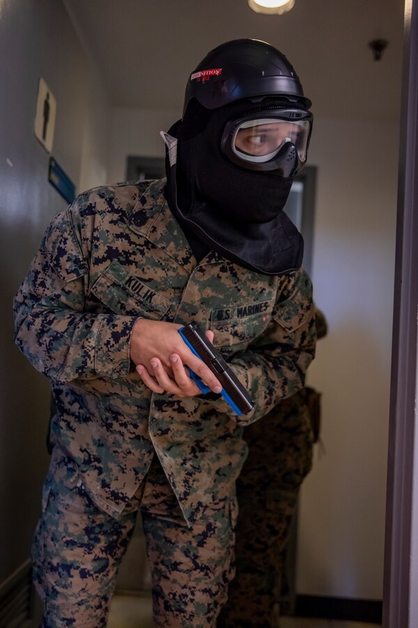 U.S. Marine Corps Staff Sgt. Marshall Kulik, a career planner with 4th Civil Affairs Group, Force Headquarters Group, provides security during a simulated active shooter exercise at Naval Operational Support Center & Marine Corps Reserve Center Miami, June 8, 2019. All 160 Marine Corps Reserve Training Centers are expected to exercise their active shooter emergency action plan semi-annually with their Inspector-Instructor staff and Reserve Marines. (U.S. Marine Corps photo by Lance Cpl. Jose Gonzalez)