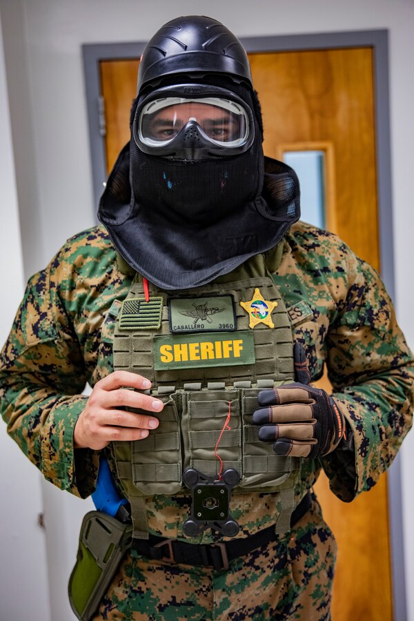 U.S. Marine Corps Gunnery Sgt. Christian Caballero, a ground operations chief with 4th Civil Affairs Group, Force Headquarters Group, participates in a simulated active shooter exercise at Naval Operational Support Center & Marine Corps Reserve Center Miami, June 8, 2019. All 160 Marine Corps Reserve Training Centers are expected to exercise their active shooter emergency action plan semi-annually with their Inspector-Instructor staff and Reserve Marines. (U.S. Marine Corps photo by Lance Cpl. Jose Gonzalez)