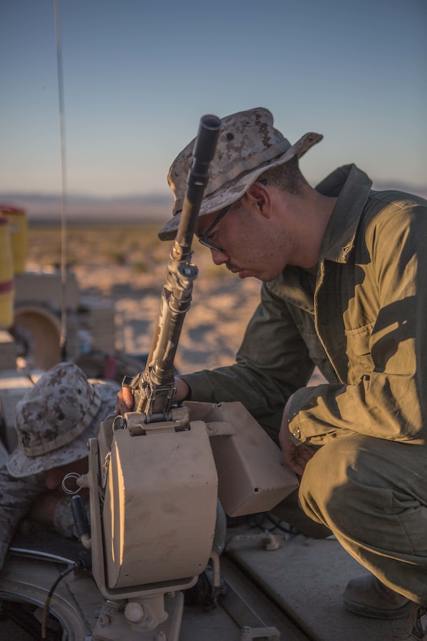 U.S. Marine Lance Cpl. Martin Munoz, a tank mechanic with A Company, 4th Tank Battalion, 4th Marine Division, prepares an M240B medium machine-gun at Range 500 during Integrated Training Exercise 4-19 at Marine Corps Air Ground Combat Center, Twentynine Palms, Calif., June 9, 2019. ITX is a combined-arms exercise conducted to prepare units for global contingencies and to increase combat readiness. (U.S. Marine Corps photo by Lance Cpl. Preston L. Morris)