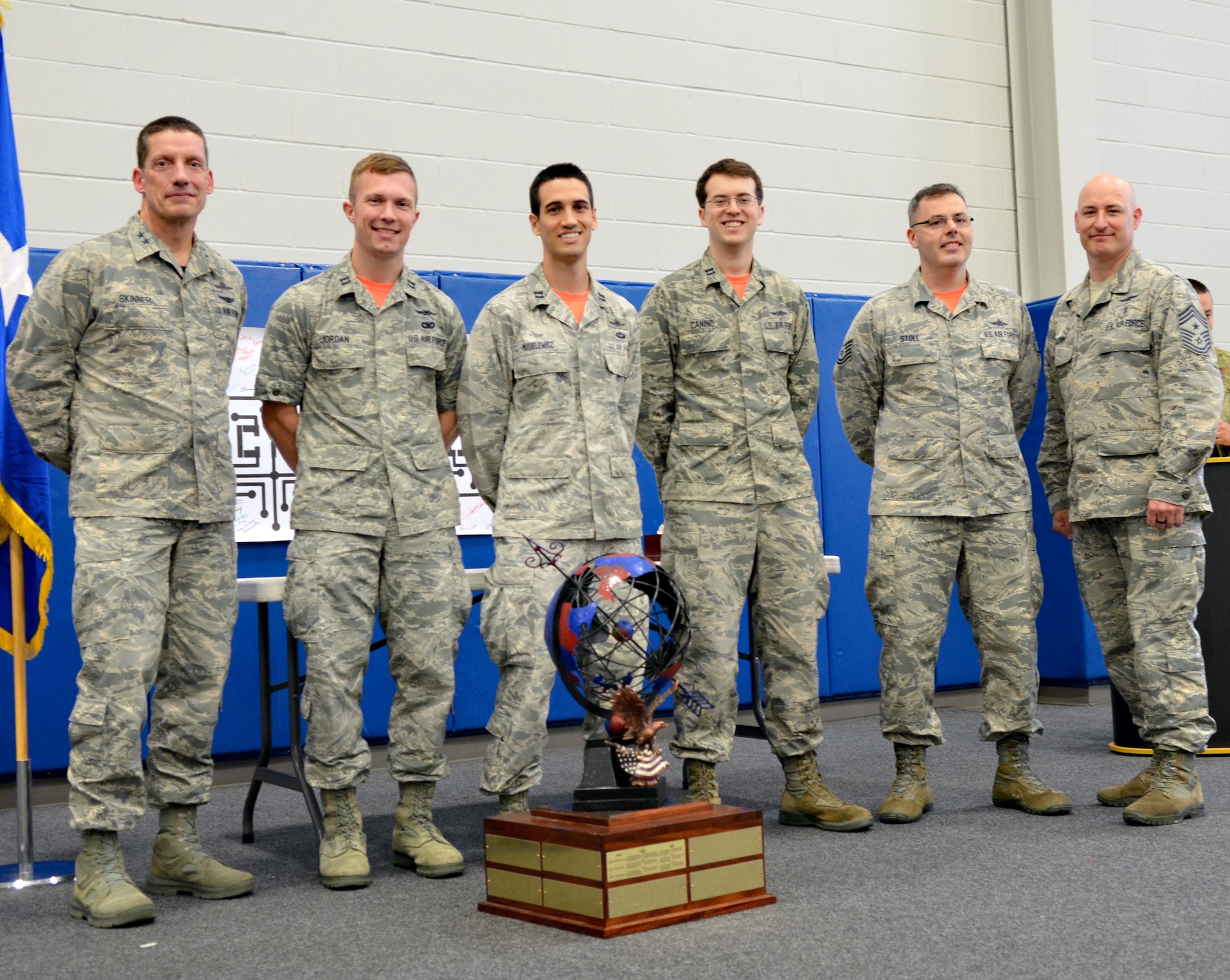 Maj. Gen. Robert Skinner, 24th Air Force commander, and Chief Master Sgt. David Klink, 24th AF command chief, pose for a photo with the 24th AF Cyber Competition unit team winner in San Antonio, Texas, June 7, 2019. The team, from the 390th Cyberspace Operations Squadron, included Capts. Paul Jordan, David Musielewicz and Anthony Canino, and Tech. Sgt. Zachary Stoll. (U.S. Air Force photo by Rachel Jones)