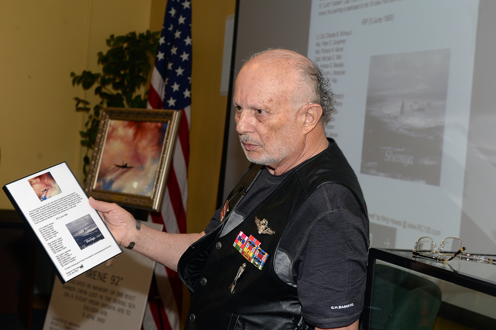 Lt. Col. Kingdon Hawes, acting 45th Reconnaissance Squadron commander the day Rivet Amber disappeared, gives a presentation during the 50th anniversary memorial of the crash of the Rivet Amber in the 45th RS Haun Auditorium at Offutt Air Force Base, Neb., June 5, 2019. Approximately 100 people attended the event, including current and former 55th Wing Airmen, many of whom are aircrew on the RC-135 Cobra Ball aircraft that conducts a similar mission set as Rivet Amber.