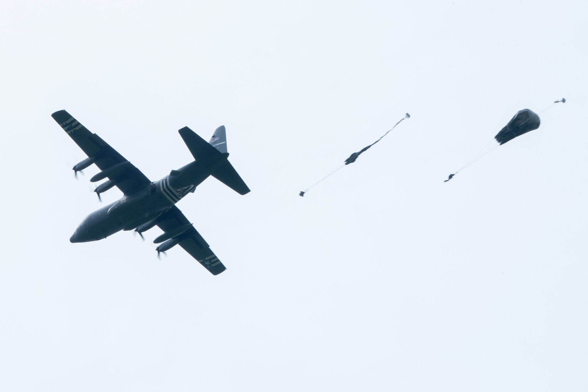 Paratroopers jump from a Kentucky Air National Guard C-130 Hercules over the Iron Mike drop zone in Sainte-Mère-Église, France, June 9, 2019, as part of the 75th-anniversary commemoration of D-Day. The Commemorative Airborne Operations event included nearly 1,000 paratroopers from Belgium, France, Germany, The Netherlands, Poland, Romania and the United Kingdom; and members of U.S. Special Operations Command Europe, United States Army Civil Affairs and Psychological Operations Command, 18th Airborne Corps, 75th Ranger Regiment, 82nd Airborne Division, 173rd Airborne Brigade, 503rd Military Police Battalion, 509th Infantry Regiment, 4th Brigade Combat Team (Airborne), 25th Infantry Division, and U.S. Air Forces Europe. D-Day remains a historic reminder of how the dedicated resolve of allies with a common purpose and shared vision builds proven partnerships that endure. (U.S. Air National Guard photo by Phil Speck)