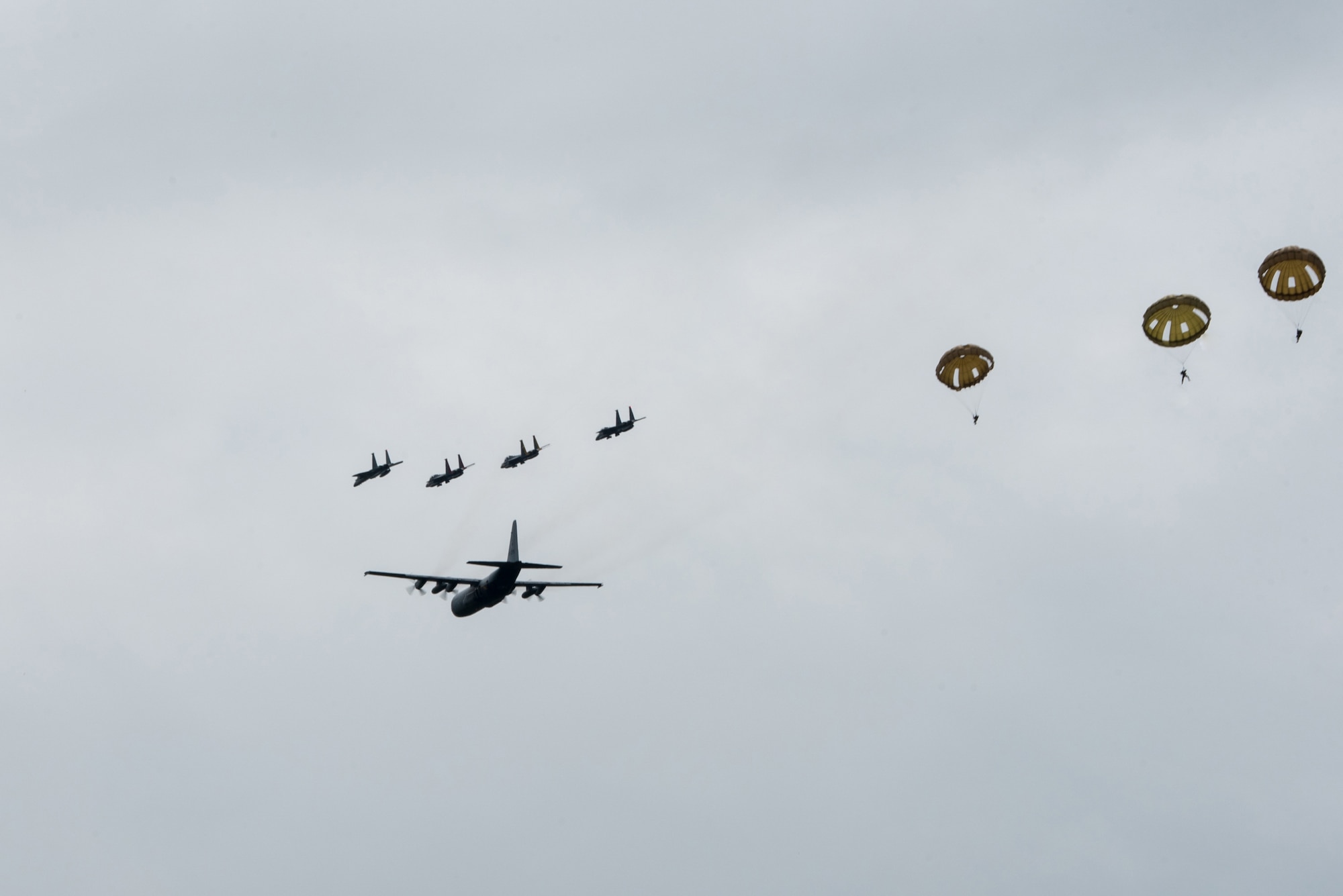 A C-130 Hercules aircraft flies over Sainte-Mère-Église, France, June 9, 2019, as part of the 75th-anniversary commemoration of D-Day. The Commemorative Airborne Operations event included nearly 1,000 paratroopers from Belgium, France, Germany, The Netherlands, Poland, Romania and the United Kingdom; and members of the Kentucky Air National Guard, U.S. Special Operations Command Europe, United States Army Civil Affairs and Psychological Operations Command, 18th Airborne Corps, 75th Ranger Regiment, 82nd Airborne Division, 173rd Airborne Brigade, 503rd Military Police Battalion, 509th Infantry Regiment, 4th Brigade Combat Team (Airborne), 25th Infantry Division, and U.S. Air Forces Europe. D-Day remains a historic reminder of how the dedicated resolve of allies with a common purpose and shared vision builds proven partnerships that endure. (U.S. Air National Guard photo by Phil Speck)