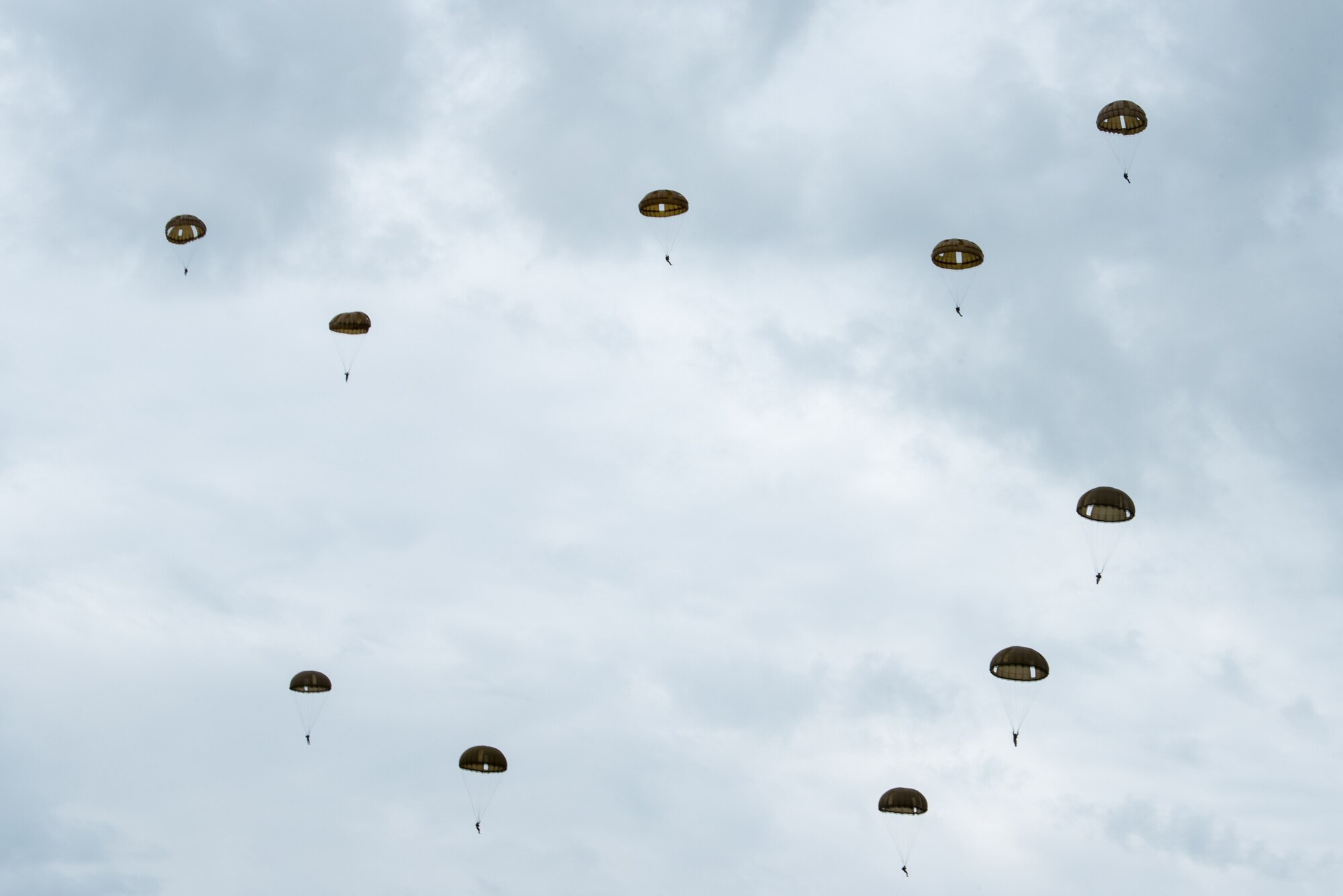 Nearly 1,000 paratroopers from multiple countries descend over the Iron Mike drop zone in Sainte-Mère-Église, France, June 9, 2019, as part of the 75th-anniversary commemoration of D-Day. The Commemorative Airborne Operations event included nearly 1,000 paratroopers from Belgium, France, Germany, The Netherlands, Poland, Romania and the United Kingdom; and members of the Kentucky Air National Guard, U.S. Special Operations Command Europe, United States Army Civil Affairs and Psychological Operations Command, 18th Airborne Corps, 75th Ranger Regiment, 82nd Airborne Division, 173rd Airborne Brigade, 503rd Military Police Battalion, 509th Infantry Regiment, 4th Brigade Combat Team (Airborne), 25th Infantry Division, and U.S. Air Forces Europe. D-Day remains a historic reminder of how the dedicated resolve of allies with a common purpose and shared vision builds proven partnerships that endure. (U.S. Air National Guard photo by Phil Speck)