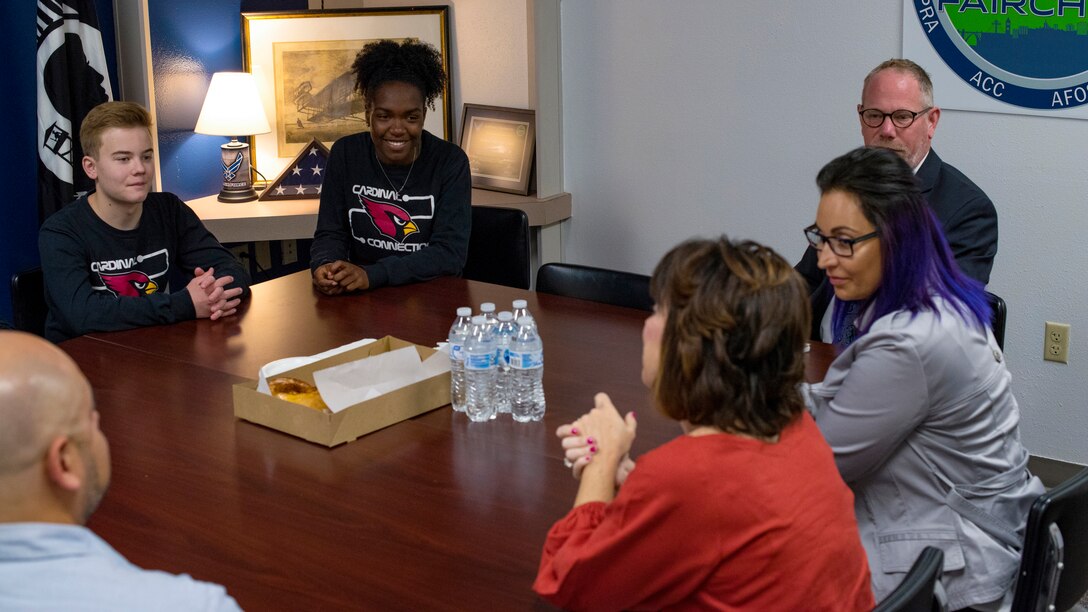 Medical Lake High School Cardinal Connections Peer Ambassador Team members speak with Kelly Barrett, 18th Air Force commander spouse, and Trish Simpson, 18 AF command chief spouse, at Medical Lake, Washington, May 22, 2019. Cardinal Connections is a military children education initiative that helps new military students find their classes, have someone to eat lunch with and help introduce them to other students. (U.S. Air Force photo by Airman 1st Class Whitney Laine)