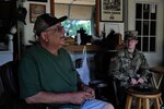 Sand Springs, Oklahoma, resident Bob Casebold sits in his garage with Spc. Kailey Bellville, a unit supply specialist in Headquarters Company, 1st Battalion, 279th Infantry Regiment, 45th Infantry Brigade Combat Team, Oklahoma Army National Guard, after she helped lay sandbags around trees at his Sand Springs home May 30, 2019.