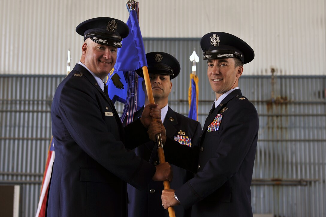 U.S. Air Force Lt. Col. Andrew Lazar (right), 58th Operations Support Squadron incoming commander, poses after he receives command of the 58th OSS from U.S. Air Force Col. Richard Carrell, 58th Operations Group commander, during the 58th OSS change of command ceremony at Kirtland Air Force Base, N.M., June 6, 2019. The mission of the 58th OSS is to provide training and support to tomorrow’s special operations, personnel recovery, and homeland defense warriors. (U.S. Air Force photo by Staff Sgt. Dylan Nuckolls)