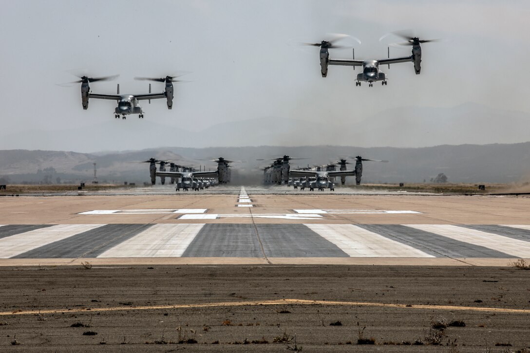 U.S. Marine Corps MV-22B Ospreys with Marine Medium Tiltrotor Squadrons (VMM) 161, 165 and 166, Marine Aircraft Group (MAG) 16, 3rd Marine Aircraft Wing (MAW), take off from the flight line during a mass flight exercise at Marine Corps Air Station Miramar, Calif., June 6, 2019. MAG-16’s commitment of operational excellence and lethality was demonstrated in a mass flight, which featured more than 40 aircraft. (U.S. Marine Corps photo by Sgt. Jake McClung)