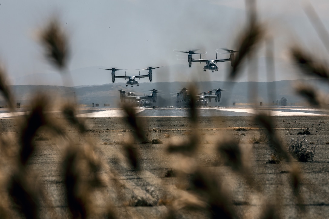 U.S. Marine Corps MV-22B Ospreys with Marine Medium Tiltrotor Squadrons (VMM) 161, 165 and 166, Marine Aircraft Group (MAG) 16, 3rd Marine Aircraft Wing (MAW), take off from the flight line during a mass flight exercise at Marine Corps Air Station Miramar, Calif., June 6, 2019. MAG-16’s commitment of operational excellence and lethality was demonstrated in a mass flight, which featured more than 40 aircraft. (U.S. Marine Corps photo by Sgt. Jake McClung)