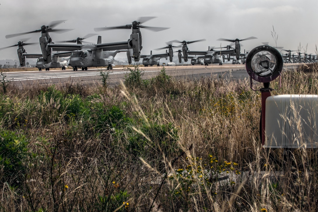 U.S. Marine Corps MV-22B Ospreys with Marine Medium Tiltrotor Squadron (VMM) 161, Marine Aircraft Group (MAG) 16, 3rd Marine Aircraft Wing (MAW), prepare to fly at Marine Corps Air Station Miramar, Calif., June 6, 2019. In a dynamic display of combat power that featured over 40 aircraft in MAG-16’s mass flight, the aircraft showcased the tactical capabilities and power that the Marine Air Ground Task Force uses to defend the nation. (U.S. Marine Corps photo by Sgt. Jake McClung)