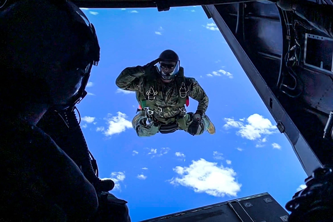 A Marine jumps from an aircraft.