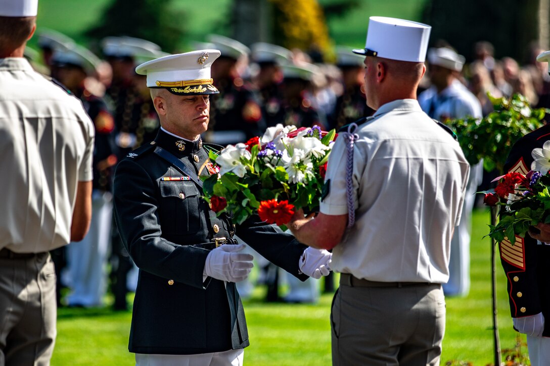 U.S. Marine Corps Col. George C. Schreffler III, commanding officer of 5th Marine Regiment, 1st Marine Division, receives a wreath during a ceremony at the Aisne-Marne Memorial near Belleau, France, May 26, 2019.