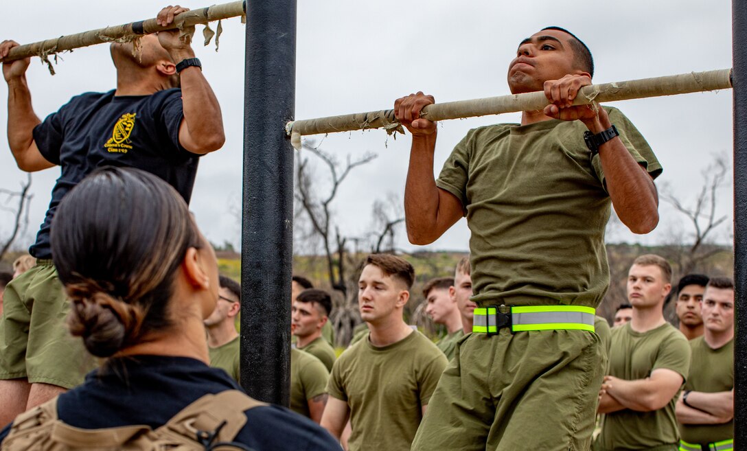 U.S. Marine Corps Cpl. Eddgar Cabrera, an assaultman with 11th Marine Regiment, 1st Marine Division, performs a pull-up for a physical fitness test, during a Command Sponsored Corporals Course (CSCC), at Marine Corps Base Camp Pendleton, California, June 3, 2019