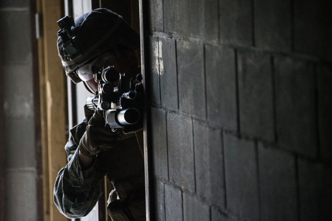 U.S. Marine Corps Cpl. Frederick C. Bailey III, a team leader with Echo Company, 2nd Battalion, 7th Marines, Special Purpose Marine Air Ground Task Force 7, sights in using a M4 carbine rifle, part of the units' squad competitions, during exercise Northern Edge (NE), May 22, 2019 at Fort Greely, Alaska.