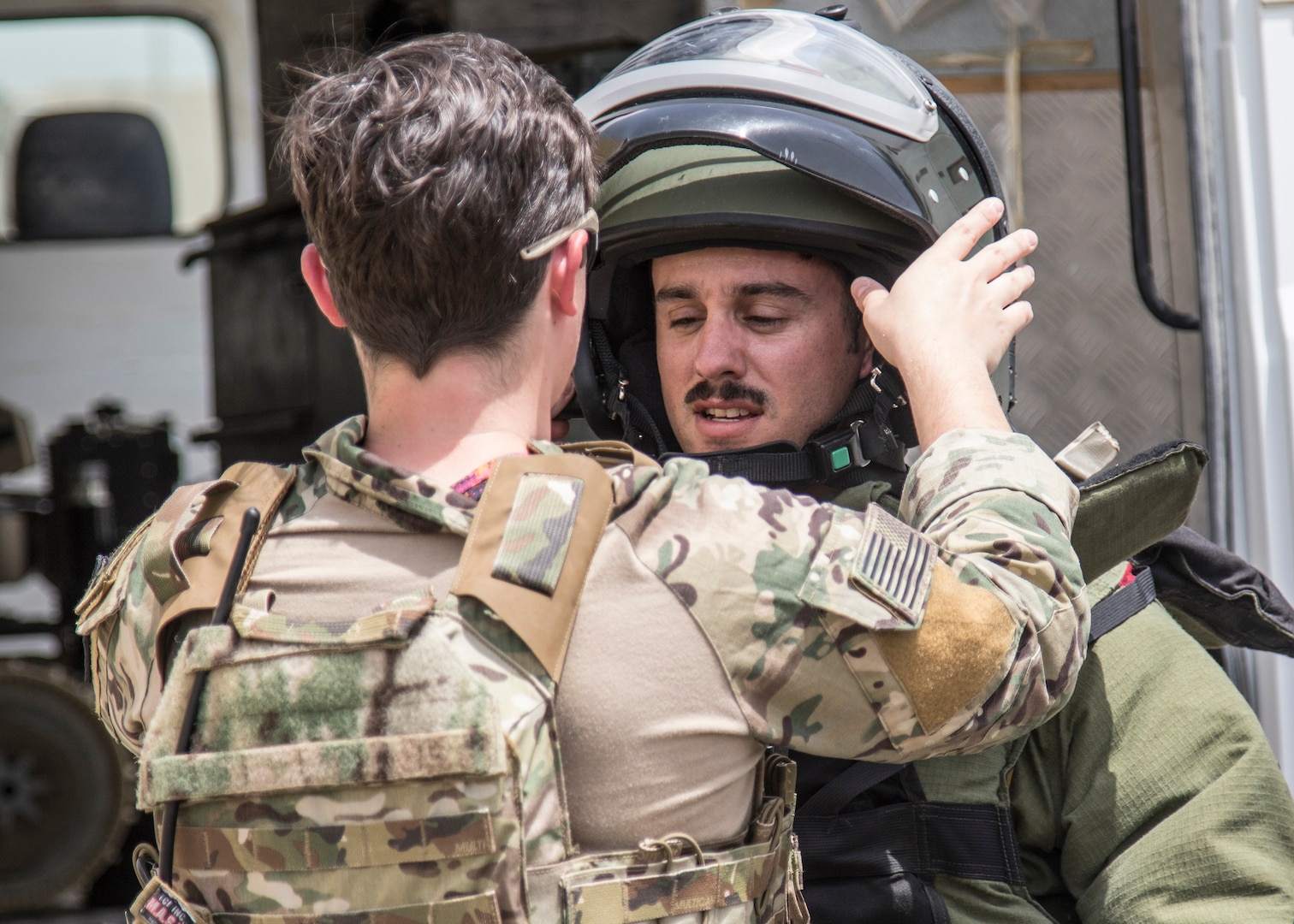 A U.S. Army Soldier from the 744th Explosive Ordnance Disposal Company from Task Force Hellhound puts on his bomb suit on May 2, 2019 for a joint exercise with a simulated terrorist, explosive ordnance, and chemical situation at the Kuwait Special Forces Training Center. The exercise was crafted to build a shared understanding of Kuwait Civil Authorities and U.S. Forces procedures while reacting to any disaster, natural and manmade alike.