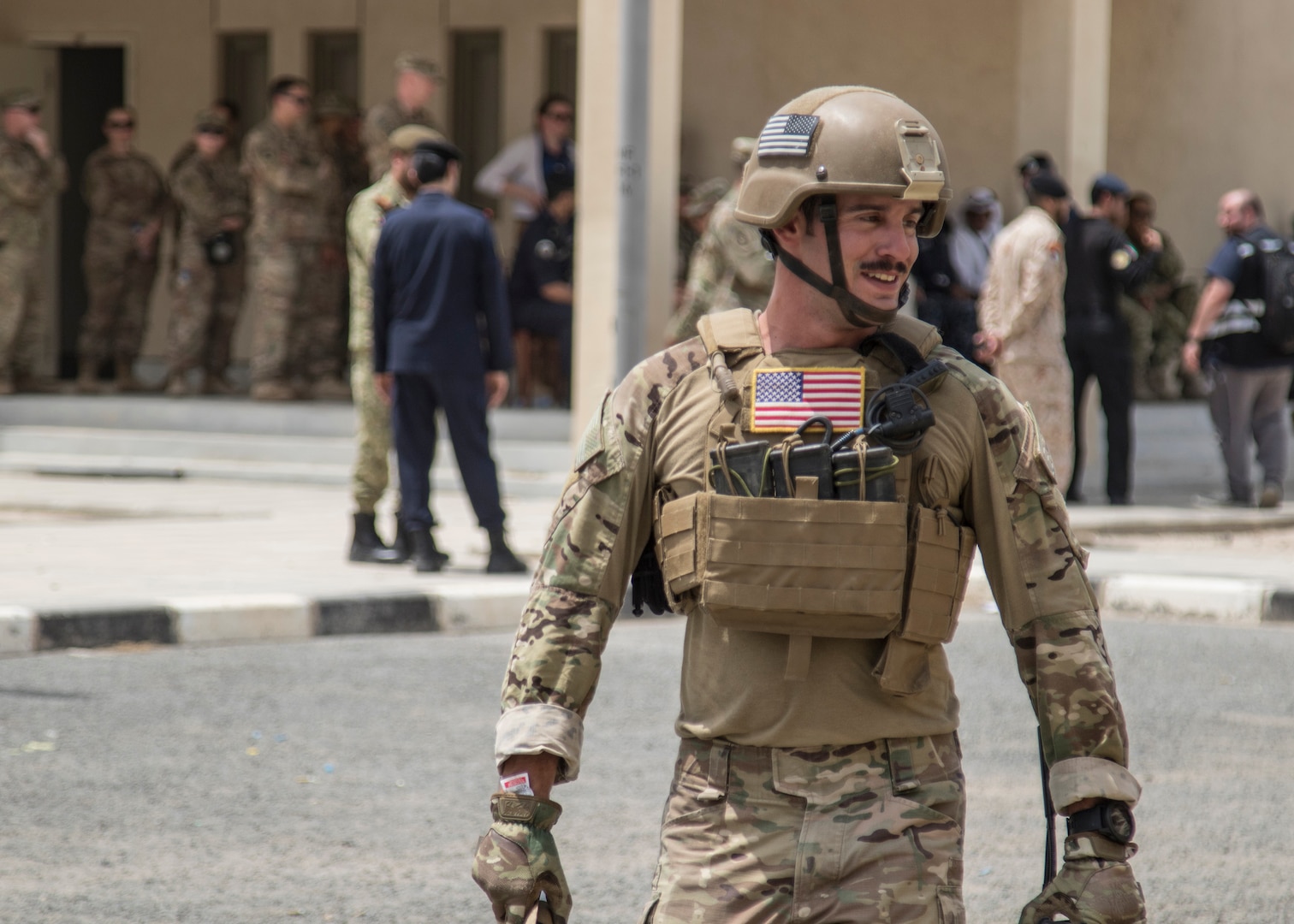 A U.S. Army Soldier from the 744th Explosive Ordnance Disposal Company from Task Force Hellhound walks back to his truck after completing his tasks with an explosive ordnance on May 2, 2019 during a joint exercise with a simulated terrorist, explosive ordnance, and chemical situation at the Kuwait Special Forces Training Center. The exercise was crafted to build a shared understanding of Kuwait Civil Authorities and U.S. Forces procedures while reacting to any disaster, natural and manmade alike.