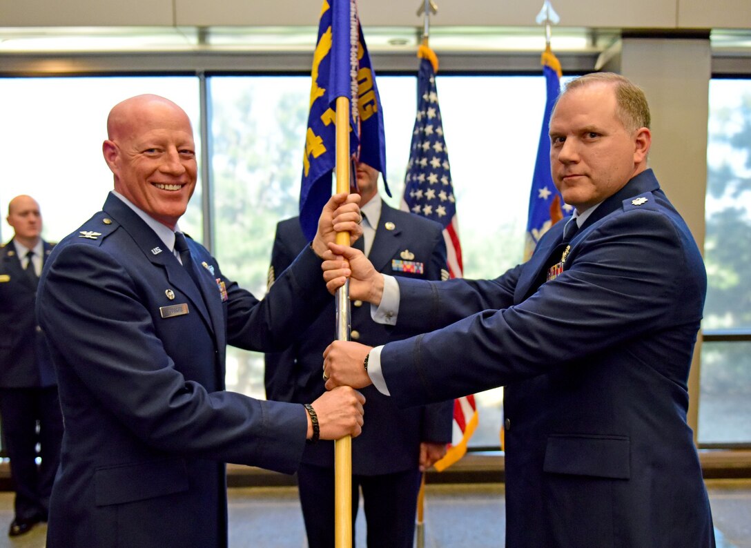 SCHRIEVER AIR FORCE BASE, Colo. – Col. Todd Tobergte, 926th Operations Group commander, presided over the 14th Test Squadron’s change of command ceremony June 1, 2019. Outgoing commander, Lt. Col. Adam Fisher, said his farewells as Lt. Col. Glenn Richard took command of the test squadron. (U.S. Air Force photo/Staff Sgt. Laura Turner)