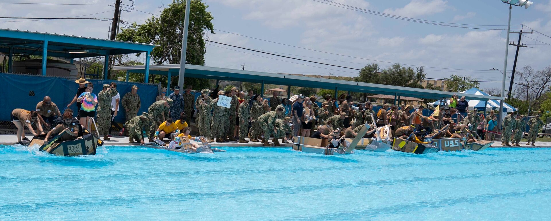 Sailors assigned to Navy Medicine Training Support Command, Defense Health Agency and Navy Medicine Education, Training and Logistics Command completed in a cardboard boat race as part of a Sailor 360 event at the Medicine Education Training Campus at Joint Base San Antonio-Fort Sam Houston. The event was part of Sailor 360, a Navy initiative to develop innovative and creative command-developed leadership programs.