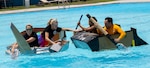 Sailors assigned to Navy Medicine Training Support Command, Defense Health Agency and Navy Medicine Education, Training and Logistics Command completed in a cardboard boat race as part of a Sailor 360 event at the Medicine Education Training Campus. The event was part of Sailor 360, a Navy initiative to develop innovative and creative command-developed leadership programs.