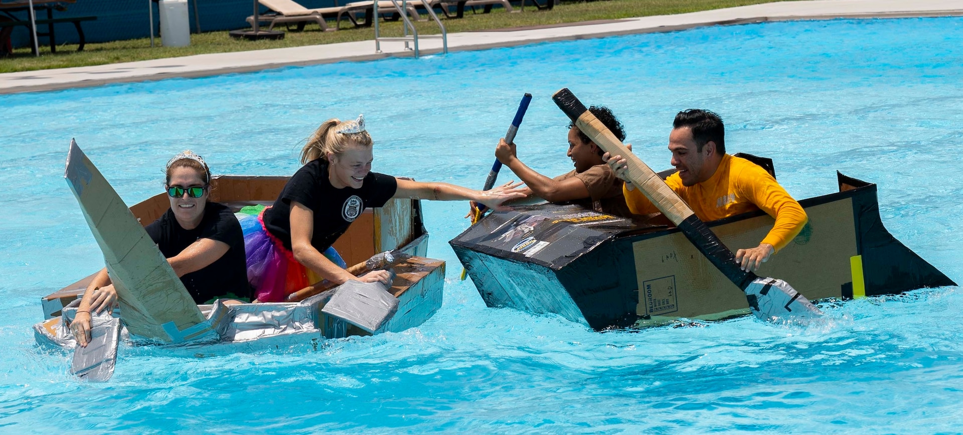 Sailors assigned to Navy Medicine Training Support Command, Defense Health Agency and Navy Medicine Education, Training and Logistics Command completed in a cardboard boat race as part of a Sailor 360 event at the Medicine Education Training Campus. The event was part of Sailor 360, a Navy initiative to develop innovative and creative command-developed leadership programs.