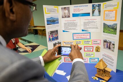 Lawrence Anyanwu, U.S. Army Financial Management Command Operations and Intelligence director, takes a photo of a display featuring facts about the Philippines during an Asian American Pacific Heritage event at the Maj. Gen. Emmett J. Bean Center here June 4, 2019. USAFMCOM and the Defense Finance and Accounting Service teamed up to host the event meant to showcase Asian and Pacific Islander heritage, whit this year’s event focused specifically on South Korea and the Philippines.