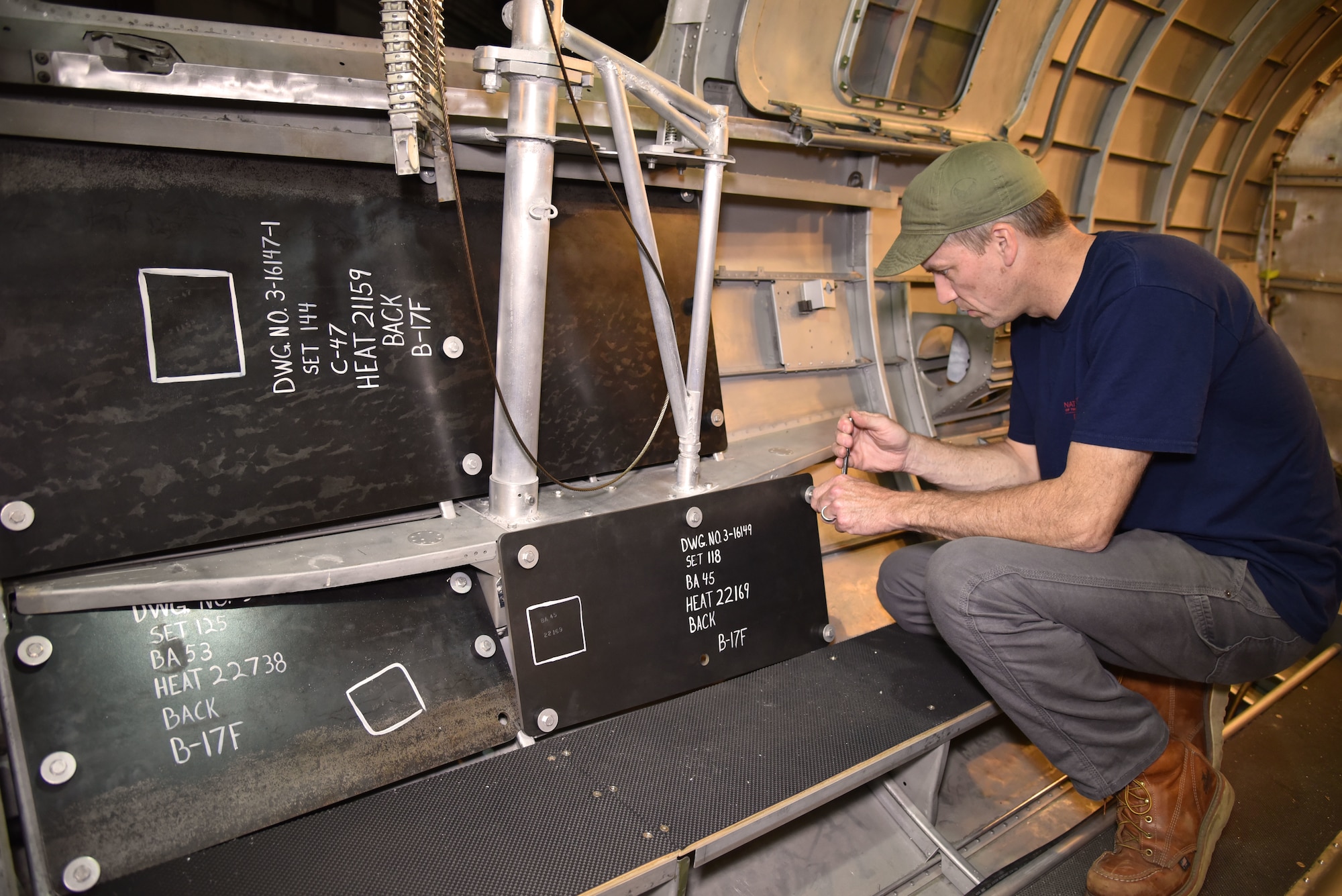 DAYTON, Ohio -- Museum restoration specialist Chad Vanhook works on the waist gun section of the Boeing B-17F Memphis Belle at the National Museum of the U.S. Air Force on June 3, 2019. (U.S. Air Force photo by Ken LaRock)