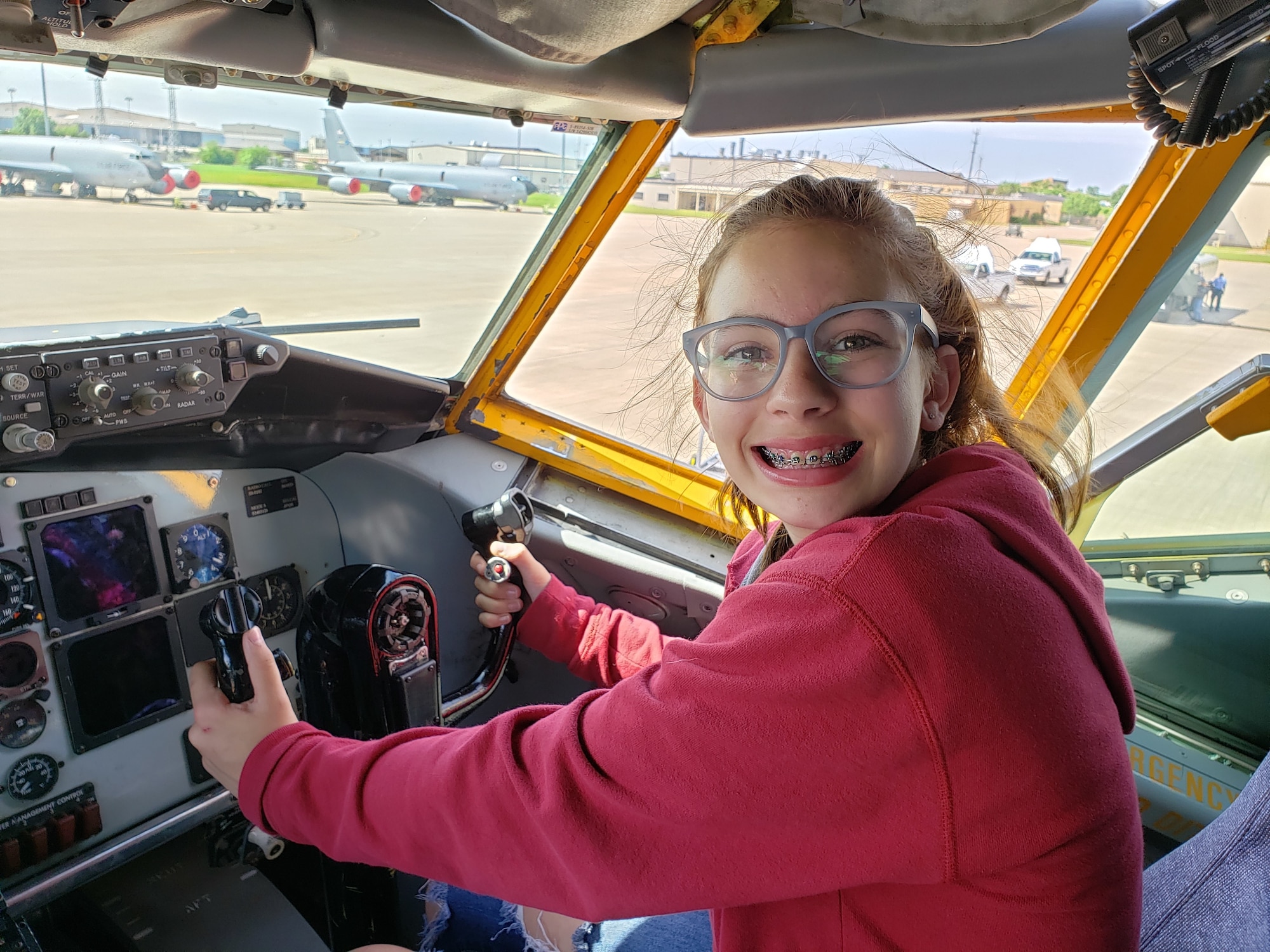 A student and participant in the 2019 Aviation Career Education Academy poses in the co-pilots chair of an Air Force Reserve KC-135R Stratotanker. The ACE academy provides middle school students weeklong immersion experiences in a variety of aviation and aerospace professions. The Oklahoma City ACE toured with the 507th ARW on June 5, 2019 at Tinker Air Force Base, Oklahoma. (U.S. Air Force Photo by Maj. Jon Quinlan)