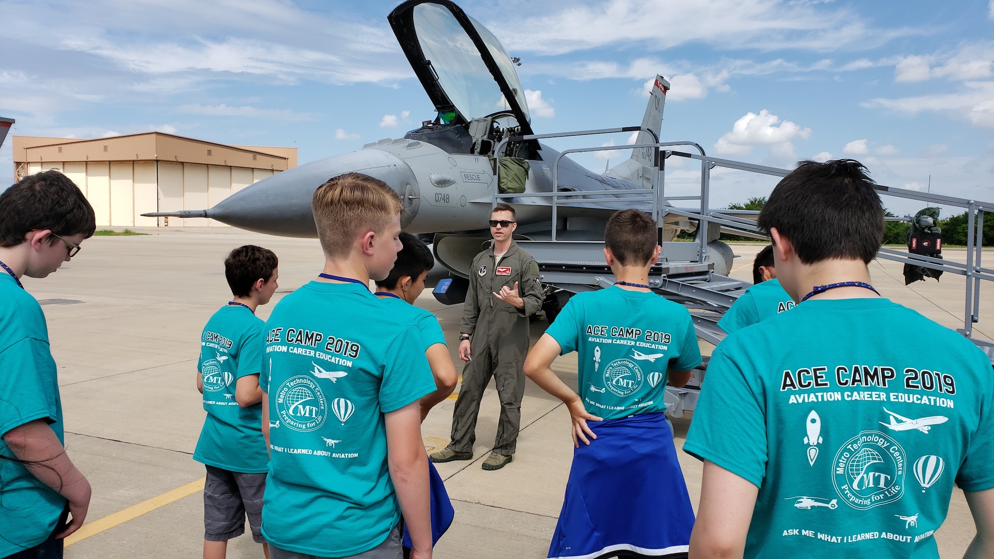 Pilots from the Oklahoma Air National Guard's 138th Fighter Wing brief students on the capabilities of the F-16 Fighting Falcon. The 2019 Aviation Career Education, or ACE academy provides middle and high school kids weeklong immersion experiences in a variety of aviation and aerospace professions. The Oklahoma City ACE toured with the 507th ARW on June 5, 2019 at Tinker Air Force Base, Oklahoma. (U.S. Air Force Photo by Maj. Jon Quinlan)