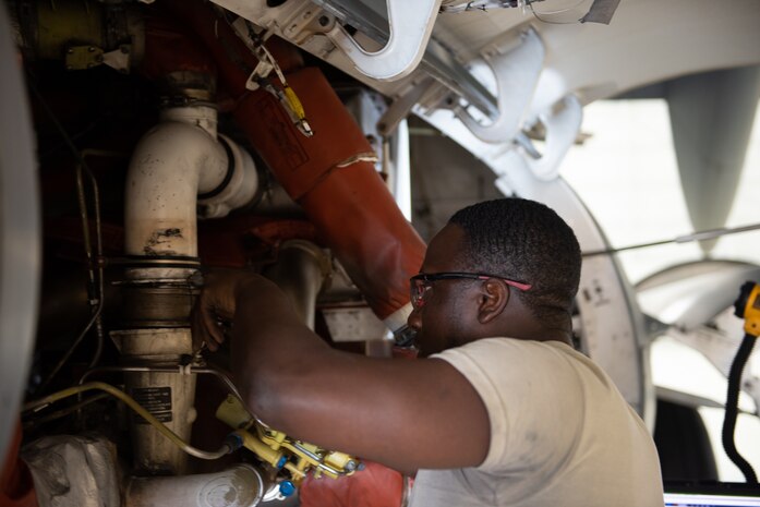 U.S. Air Force Airman 1st Class Leonard Howell, 62nd Maintenance Squadron electrical environmental apprentice, performs maintenance on the cooling system of a C-17 Globemaster III June 3, 2019, at Travis Air Force Base, California. Airmen from Joint Base Lewis-McChord, Washington, and Travis have completed 18 C-17 inspections since February. (U.S. Air Force photo by Tech. Sgt. James Hodgman)