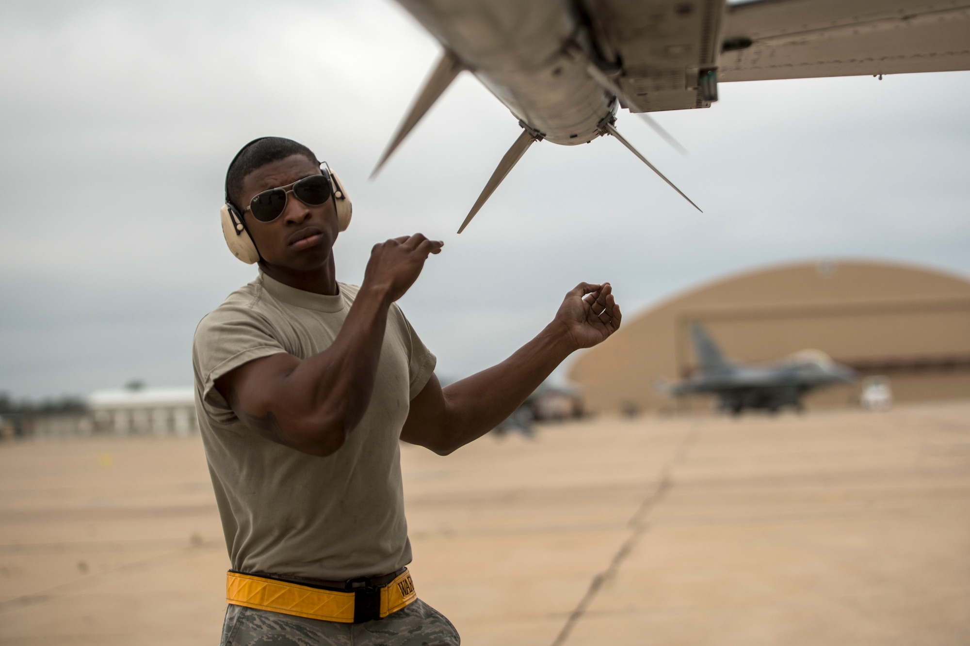 Senior Airman Avian Sharpe, 314th Aircraft Maintenance Unit weapons loader, ensures weapons are loaded to a 314th Fighter Squadron F-16 Viper, June 4, 2019, on Marine Corps Air Station Miramar, Calif. Between the 314th FS and the 314th Aircraft Maintenance Unit, 168 personnel, 16 F-16’s and 14 tons of equipment were fully functional during the temporary duty assignment in support of 258 flying training sorties. (U.S. Air Force photo by Staff Sgt. Christine Groening)