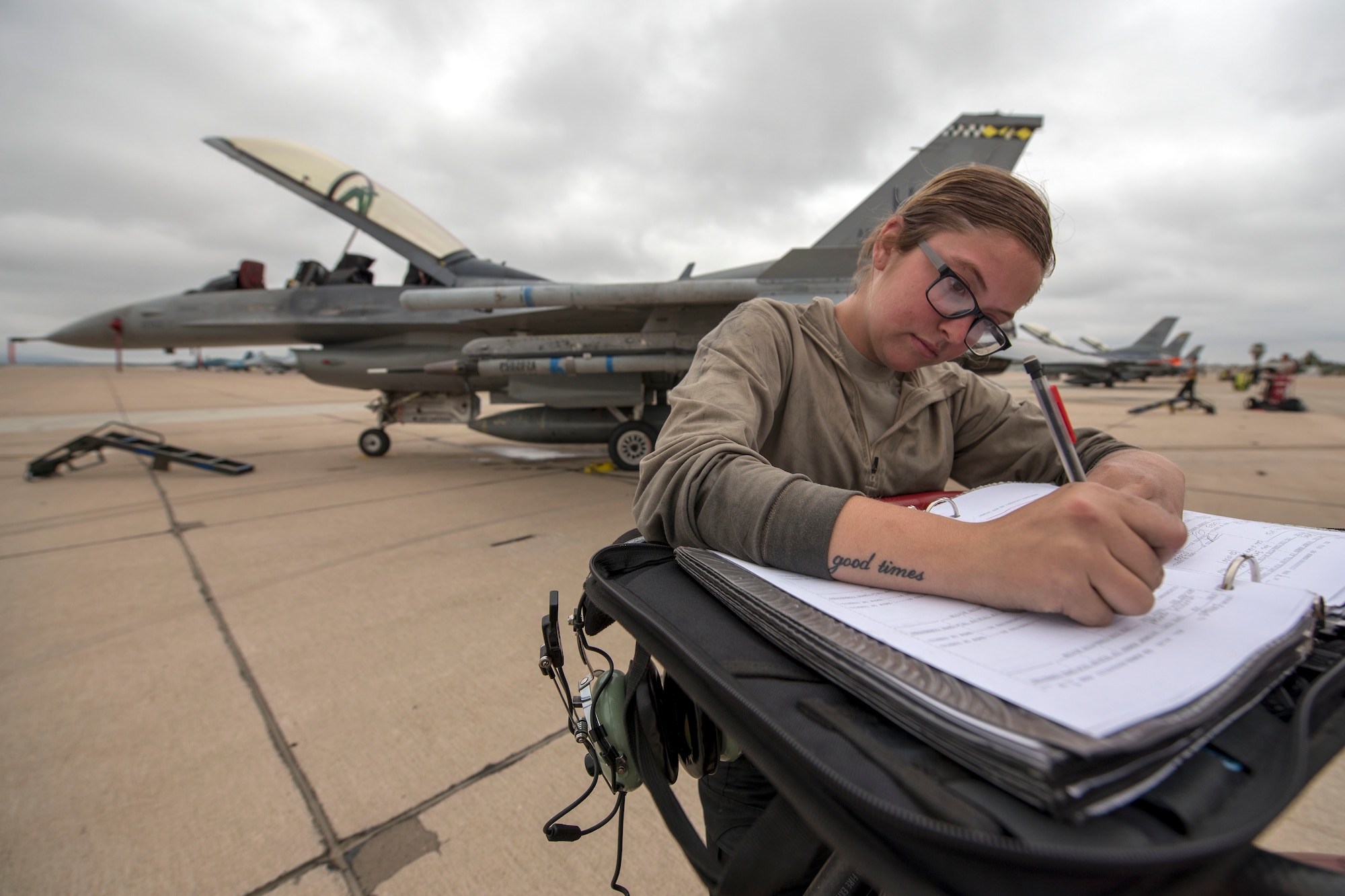 Airman 1st Class Viktoria Tooker, 311th Aircraft Maintenance Unit crew chief, writes in the maintenance log book June 4, 2019, on Marine Corps Air Station Miramar, Calif. Between the 314th Fighter Squadron and the 314th AMU, 168 personnel, 16 F-16 VIpers and 14 tons of equipment were fully functional during the temporary duty assignment in support of 258 flying training sorties. (U.S. Air Force photo by Staff Sgt. Christine Groening)