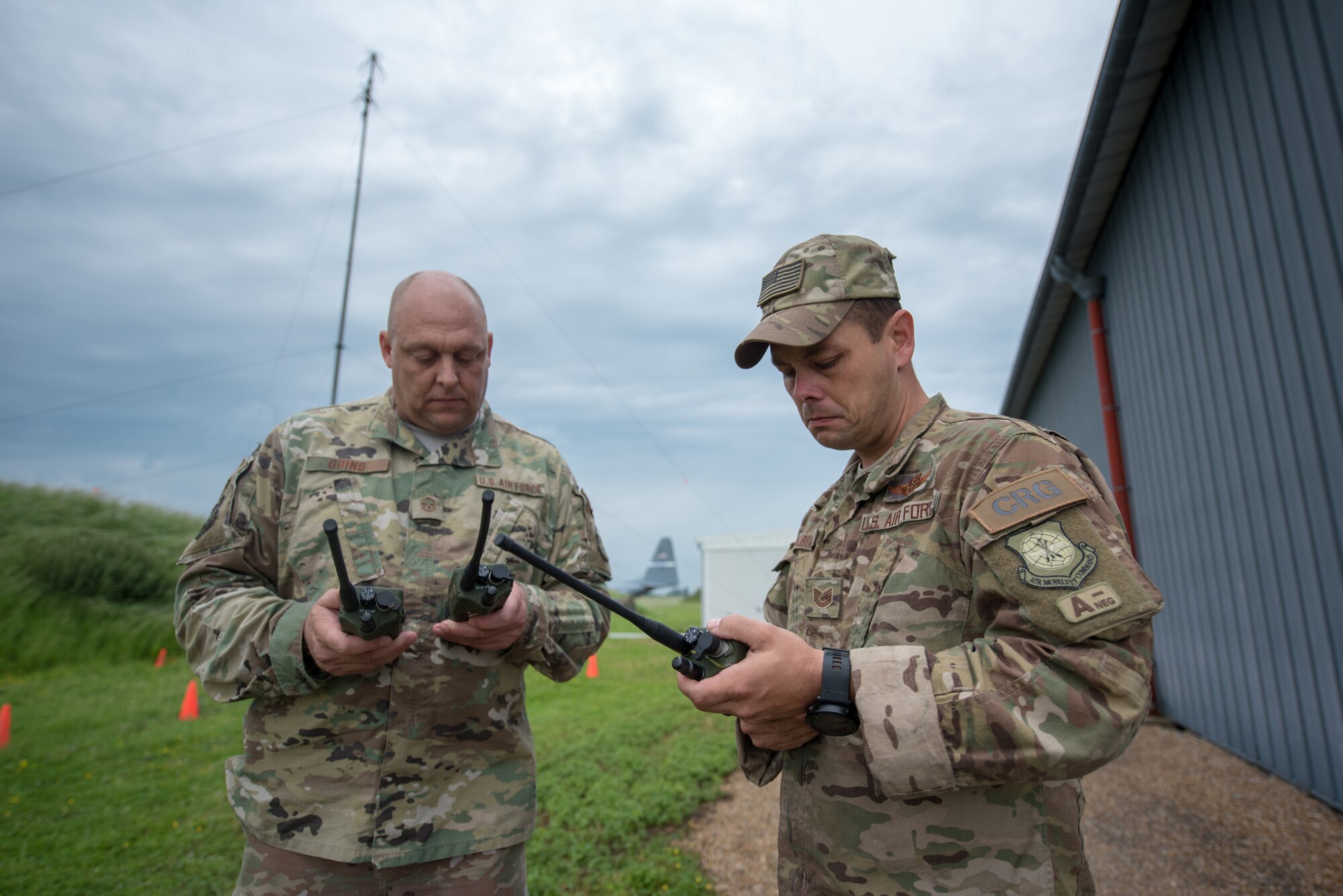 Master Sgt. Kyle Goins (left), a radio frequency transmissions technician for the Kentucky Air National Guard’s 123rd Global Mobility Squadron, and Tech. Sgt. Brian Milburn, a 123rd GMS loadmaster, check radio frequencies at Évreux-Fauville Air Base in Évreux, France, June 4, 2019. Two C-130s and more than 30 Airmen from the Kentucky Air Guard’s 123rd Airlift Wing deployed from their base in Louisville, Ky., to participate in aerial events over Normandy, France, for the 75th anniversary of D-Day. The D-Day invasion, formally known as Operation Overlord, turned the tide of World War II in the European theater. (U.S. Air National Guard photo by Phil Speck)