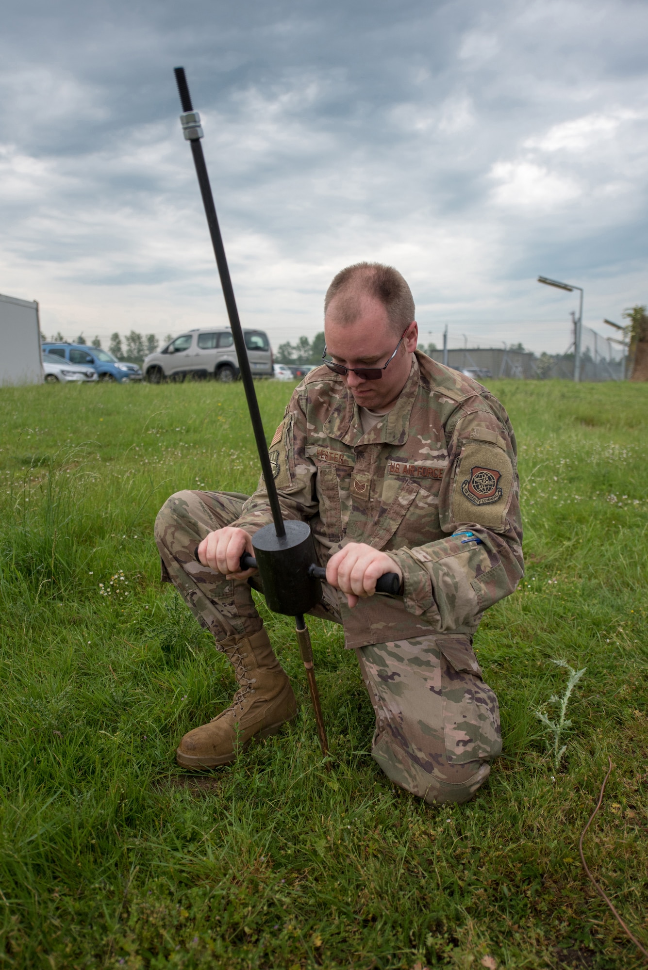 Staff Sgt. Courtnay Hester, an aircraft generation equipment mechanic for the Kentucky Air National Guard’s 123rd Global Mobility Squadron, buries a ground rod for a generator at Évreux-Fauville Air Base in Évreux, France, June 4, 2019. Two C-130s and more than 30 Airmen from the Kentucky Air Guard’s 123rd Airlift Wing deployed from their base in Louisville, Ky., to participate in aerial events over Normandy, France, for the 75th anniversary of D-Day. The D-Day invasion, formally known as Operation Overlord, turned the tide of World War II in the European theater. (U.S. Air National Guard photo by Phil Speck)