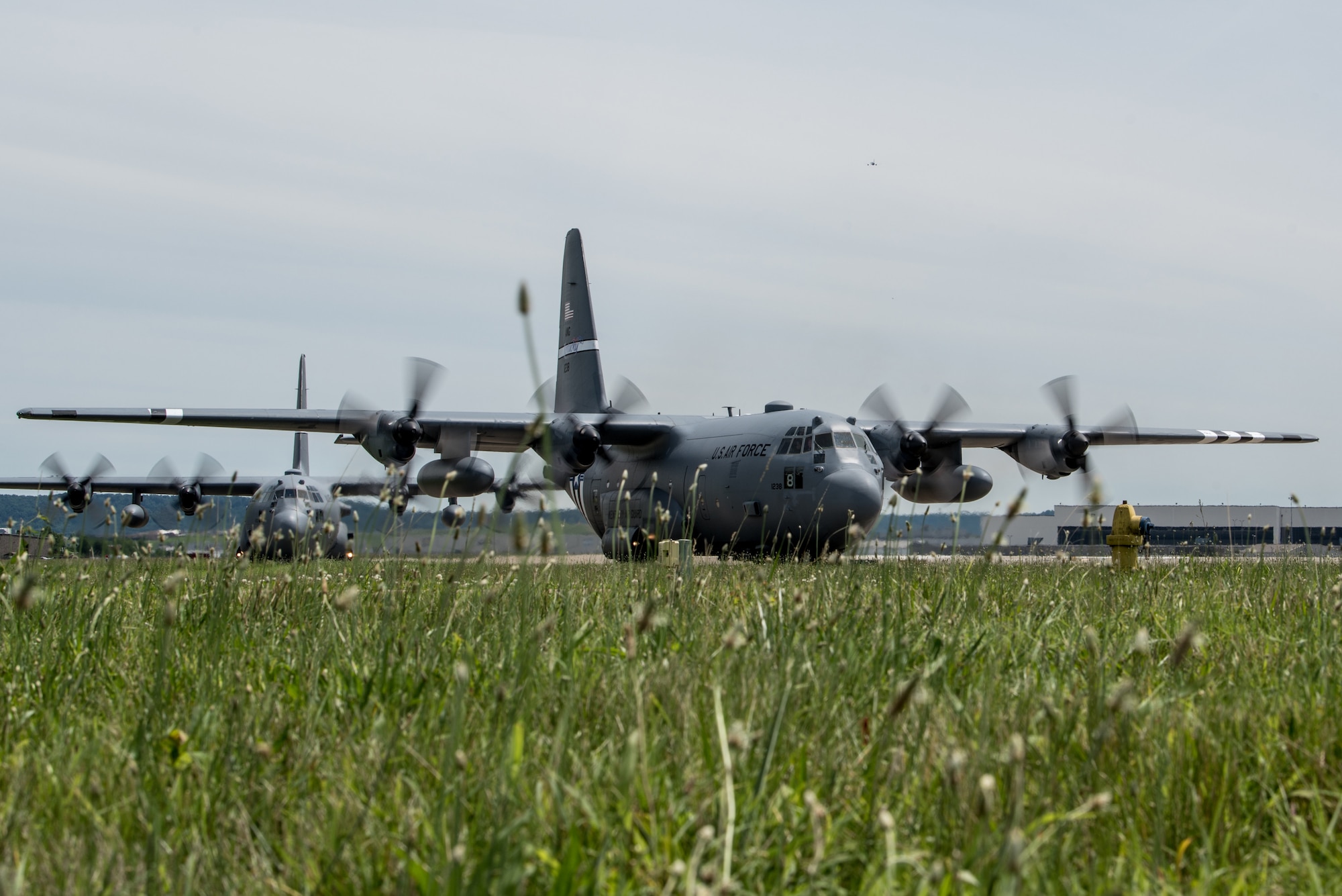 Two C-130 Hercules aircraft and more than 30 Airmen from the Kentucky Air Guard’s 123rd Airlift Wing arrive at the Kentucky Air National Guard Base in Louisville, Ky., June 11, 2019, after participating in a week-long event in France for the 75th anniversary of D-Day. The D-Day invasion, formally known as Operation Overlord, turned the tide of World War II in the European theater. (U.S. Air National Guard photo by Staff Sgt. Joshua Horton)