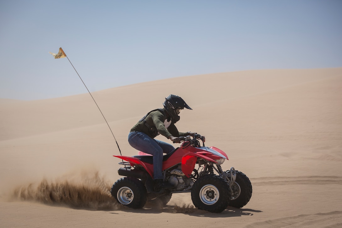 U.S. Marines with Marine Corps Air Station (MCAS) Yuma, ride 4x4 All-Terrain Vehicles and a Razor Side by Side through the Imperial Sand Dunes in El Centro Calif., April 29, 2019. MCCS Arizona Adventures is located aboard MCAS Yuma, affording Marines the opportunity to rent out an assortment of adrenaline-fueled gear including boats, jet skis, kayaks, and more. (U.S. Marine Corps photo by Sgt. Allison Lotz)