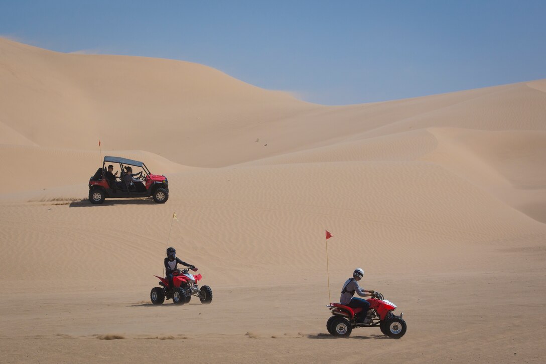U.S. Marines with Marine Corps Air Station (MCAS) Yuma, ride 4x4 All-Terrain Vehicles and a Razor Side by Side through the Imperial Sand Dunes in El Centro Calif., April 29, 2019. MCCS Arizona Adventures is located aboard MCAS Yuma, affording Marines the opportunity to rent out an assortment of adrenaline-fueled gear including boats, jet skis, kayaks, and more. (U.S. Marine Corps photo by Sgt. Allison Lotz)