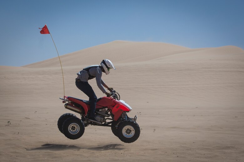 U.S. Marines with Marine Corps Air Station (MCAS) Yuma, ride 4x4 All-Terrain Vehicles and a Razor Side by Side through the Imperial Sand Dunes in El Centro Calif., April 29, 2019. MCCS Arizona Adventures is located aboard MCAS Yuma, affording Marines the opportunity to rent out an assortment of adrenaline-fueled gear including boats, jet skis, kayaks, and more. (U.S. Marine Corps photo by Sgt. Allison Lotz)