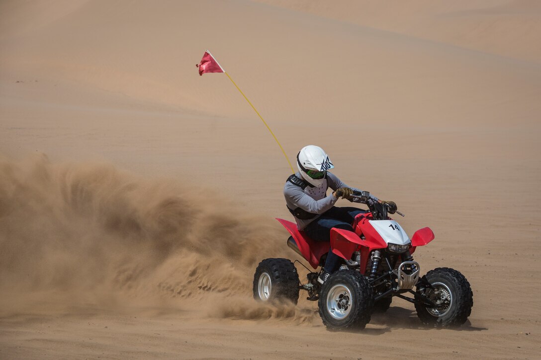 U.S. Marines with Marine Corps Air Station (MCAS) Yuma, ride 4x4 All-Terrain Vehicles and a Razor Side by Side through the Imperial Sand Dunes in El Centro Calif., April 29, 2019. MCCS Arizona Adventures is located aboard MCAS Yuma, affording Marines the opportunity to rent out an assortment of adrenaline-fueled gear including boats, jet skis, kayaks, and more. (U.S. Marine Corps photo by Sgt. Allison Lotz)