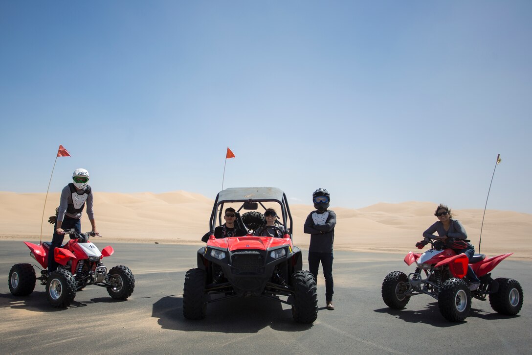 U.S. Marines with Marine Corps Air Station (MCAS) Yuma, ride 4x4 All-Terrain Vehicles and a Razor Side by Side through the Imperial Sand Dunes in El Centro Calif., April 29, 2019. MCCS Arizona Adventures is located aboard MCAS Yuma, affording Marines the opportunity to rent out an assortment of adrenaline-fueled gear including boats, jet skis, kayaks, and more. (U.S. Marine Corps photo by Sgt. Allison Lotz)