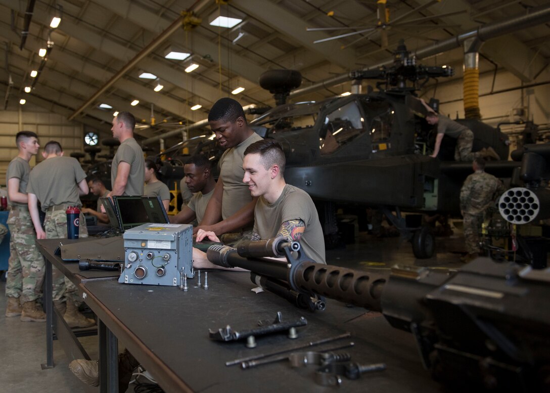 U.S. Army Advanced Individual Training students assigned to the 222nd Aviation Regiment, 1st Aviation Battalion, 128th Aviation Brigade participate in hands-on training during the AH-64 Armament/Electrical/Avionic Systems Repairer course at Joint Base Langley-Eustis, Virginia, June 10, 2019.
