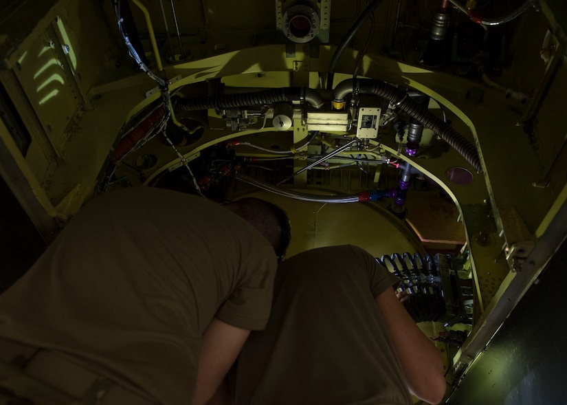 U.S. Army Advanced Individual Training students assigned to the 222nd Aviation Regiment, 1st Aviation Battalion, 128th Aviation Brigade install an ammunition conveyer assembly during an AH-64 Armament/Electrical/Avionic Systems Repairer course at Joint Base Langley-Eustis, Virginia, June 10, 2019.