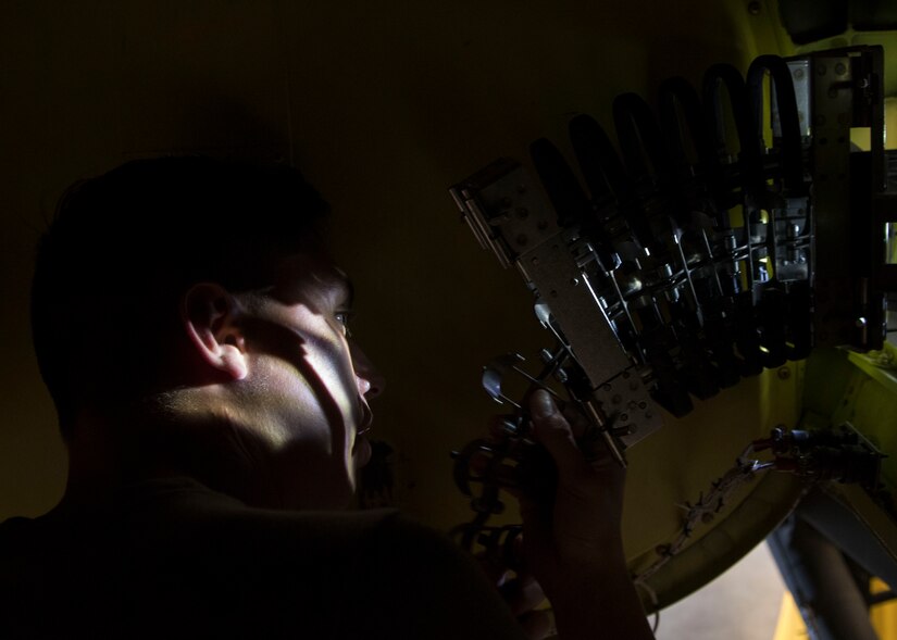 U.S. Army Pfc. Zackary Cordova, Bravo Company, 222nd Aviation Regiment, 1st Aviation Battalion, 128th Aviation Brigade, ensures proper installation of an ammunition conveyer assembly during an AH-64 Armament/Electrical/Avionic Systems Repairer course at Joint Base Langley-Eustis, Virginia, June 10, 2019.