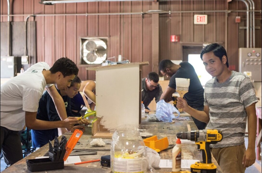 51st Fighter Wing Airmen and local youth from the Boy Scouts of America’s Far East Council, Asia West District Troop 86 craft a wooden box for Team Osan’s Tiny Library Project at Osan Air Base, Republic of Korea. The free book exchange program, which is designed to enrich a passion for reading while enhancing the community, has approximately 1,000 books available to exchange or take at several locations. Please contact DSN: 784-9194 for more information on the locations of the tiny libraries. (Courtesy photo)