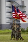 U.S. Marines with Combat Logistics Regiment 35, 3rd Marine Logistics Group, march on the regimental colors during a relief and appointment ceremony May 31, 2019, at Camp Kinser, Okinawa, Japan. Sgt. Maj. Kenneth A. Miller ceremoniously transferred accountability and authority of enlisted Marines to Sgt. Maj. John R. Preston during the ceremony. Miller, the outgoing regimental sergeant major of CLR-35, 3rd MLG, is a native of Woodland, California. Preston, the incoming regimental sergeant major of CLR-35, 3rd MLG, is a native of Easley, South Carolina. (U.S. Marine Corps photo by Lance Cpl. Terry Wong)
