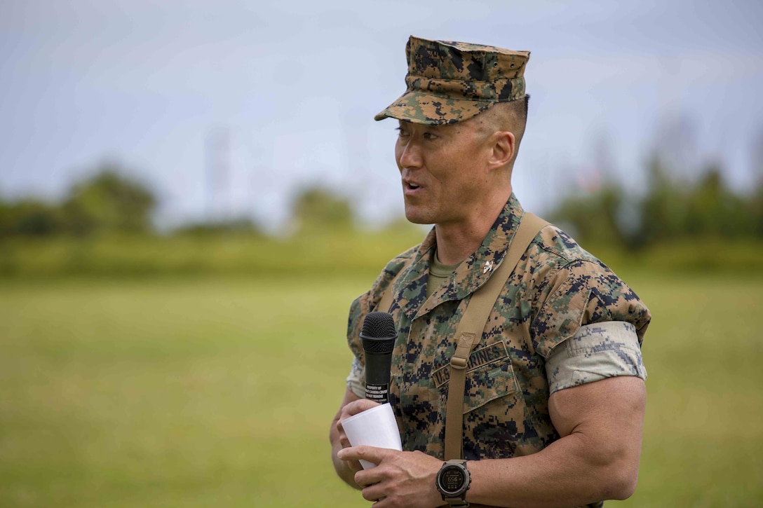 U.S. Marine Corps Col. Joon H. Um, addresses Marines and families of 3rd Marine Logistics Group, during a relief and appointment ceremony May 31, 2019, at Camp Kinser, Okinawa, Japan. Sgt. Maj. Kenneth A. Miller ceremoniously transferred accountability and authority of the enlisted Marines of Combat Logistic Regiment 35, 3rd Marine Logistics Group, to Sgt. Maj. John R. Preston during the ceremony. Um, the commanding officer of CLR-35, 3rd MLG, is a native of Tampa, Florida. (U.S. Marine Corps photo by Lance Cpl. Terry Wong)