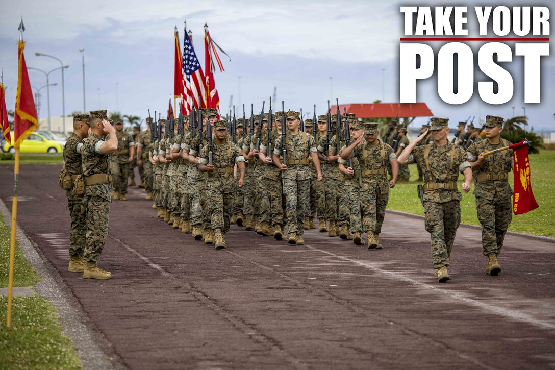 Leadership with Combat Logistics Regiment 35, 3rd Marine Logistics Group, render a salute while being honored during pass and review at a relief and appointment ceremony May 31, 2019, at Camp Kinser, Okinawa, Japan. Sgt. Maj. Kenneth A. Miller ceremoniously transferred accountability and authority of enlisted Marines to Sgt. Maj. John R. Preston during the ceremony. Miller, the outgoing regimental sergeant major of CLR-35, 3rd MLG, is a native of Woodland, California. Preston, the incoming regimental sergeant major of CLR-35, 3rd MLG, is a native of Easley, South Carolina. (U.S. Marine Corps photo by Lance Cpl. Terry Wong)